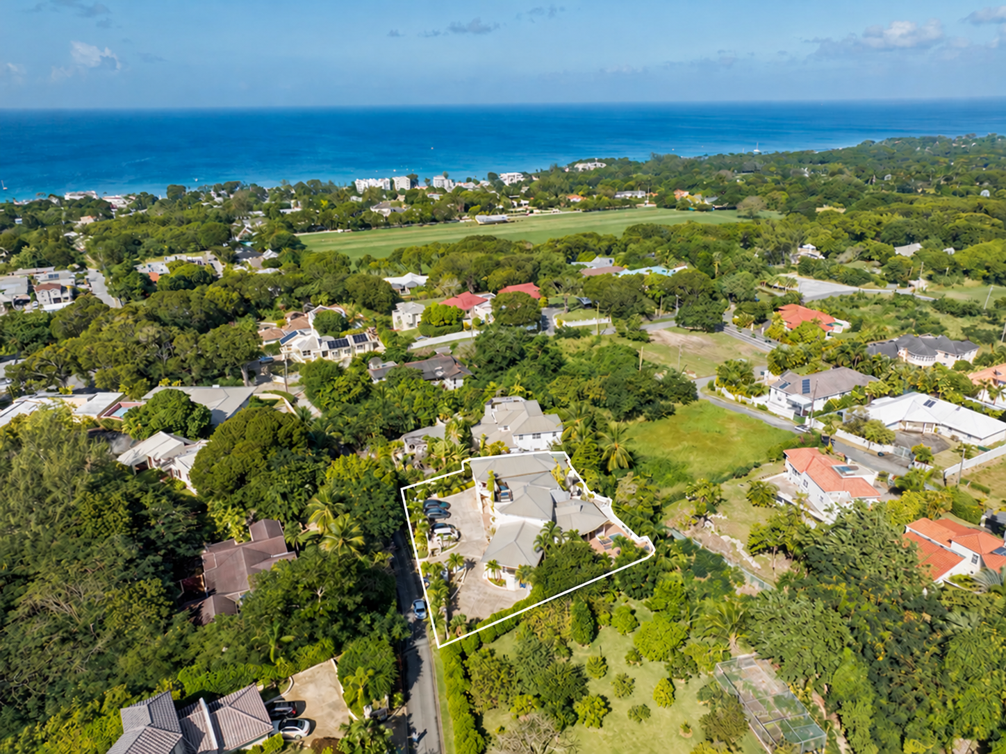 Aerial view of Holders Retreat and its surroundings, with the property outlined in white